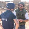 Eylon Levy, then-Israeli government spokesman, speaks with journalists near a tunnel in northern Gaza.
